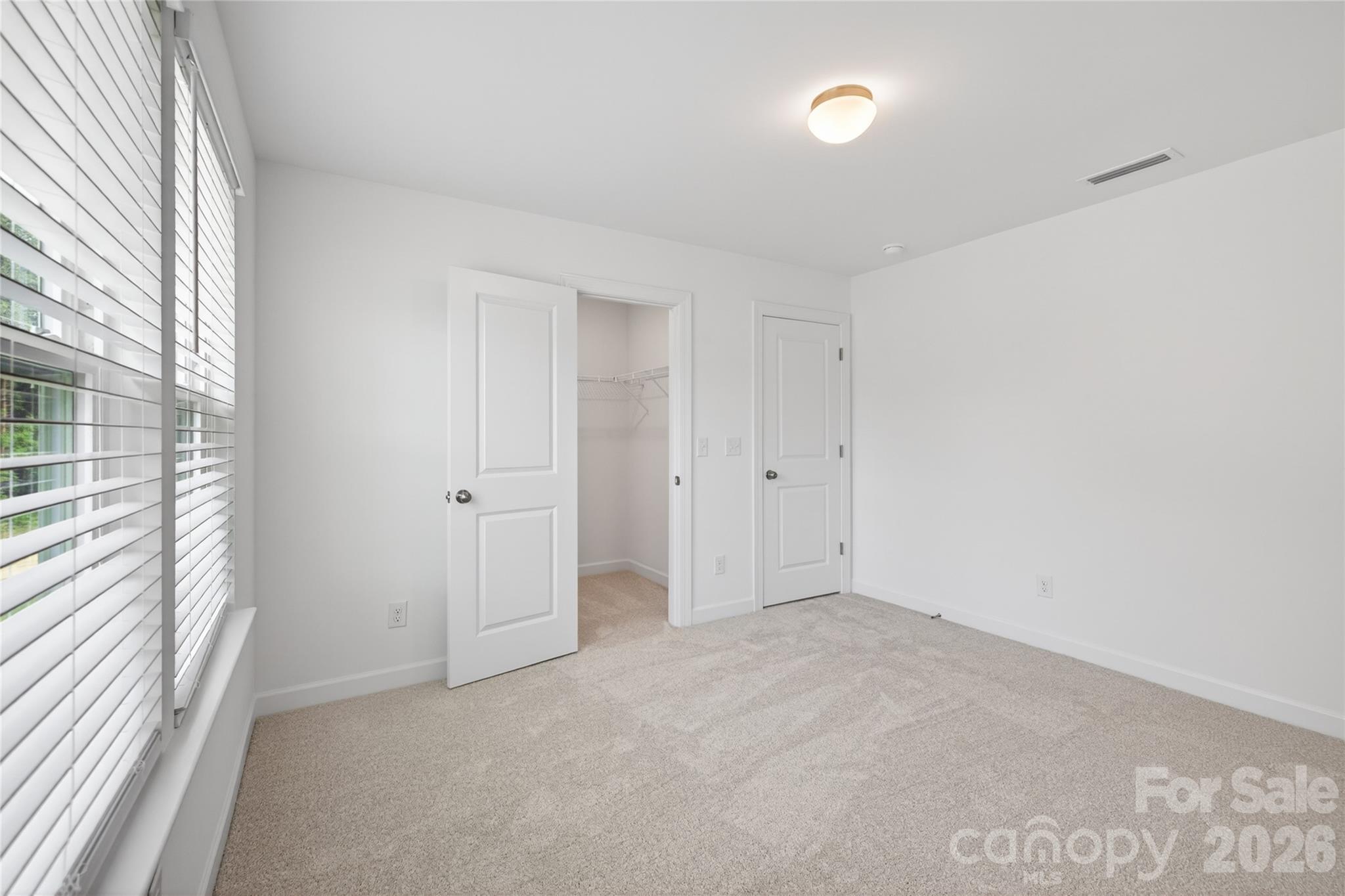128 Overcash Road, Unit 7171 Troutman, NC 28166 - Photo 26 of 41 a view of an empty room with a window