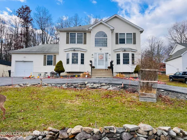 a front view of a house with swimming pool