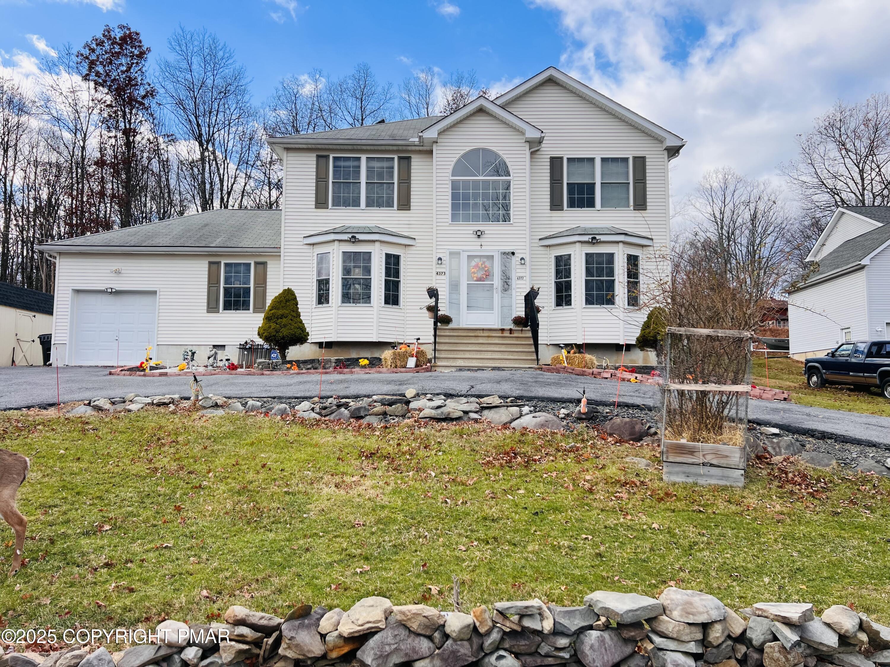 a front view of a house with swimming pool