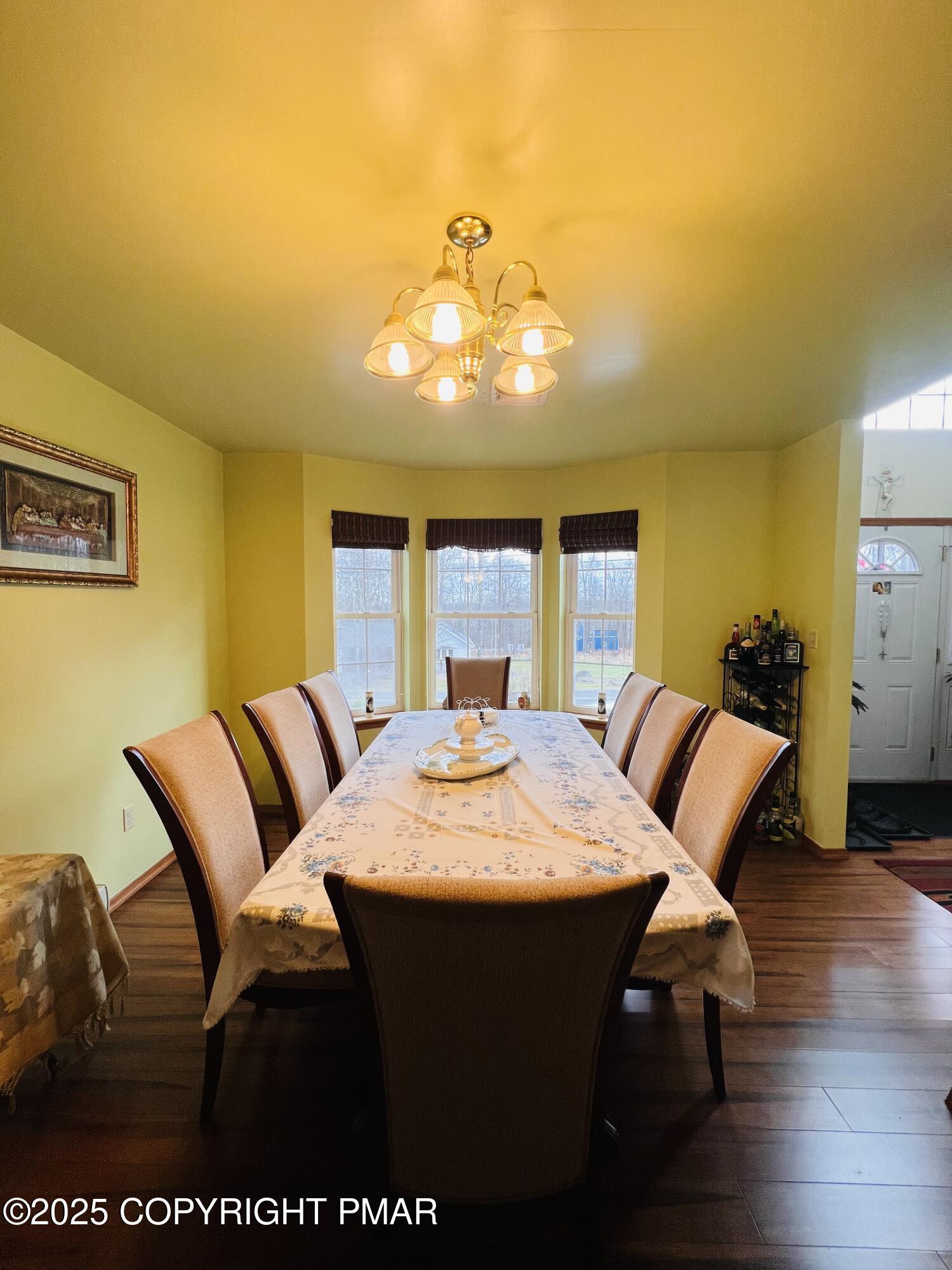 4373 Pine Ridge Drive East Bushkill, PA 18324 - Photo 11 of 39 a view of a dining room with furniture and wooden floor