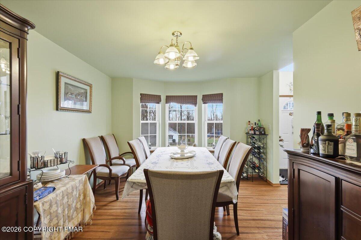 4373 Pine Ridge Drive East Bushkill, PA 18324 - Photo 13 of 33 a view of a dining room with furniture window and outside view
