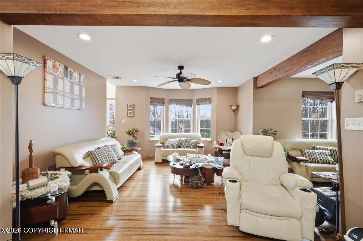 4373 Pine Ridge Drive East Bushkill, PA 18324 - Photo 14 of 33 a living room with furniture or window and a wooden floor