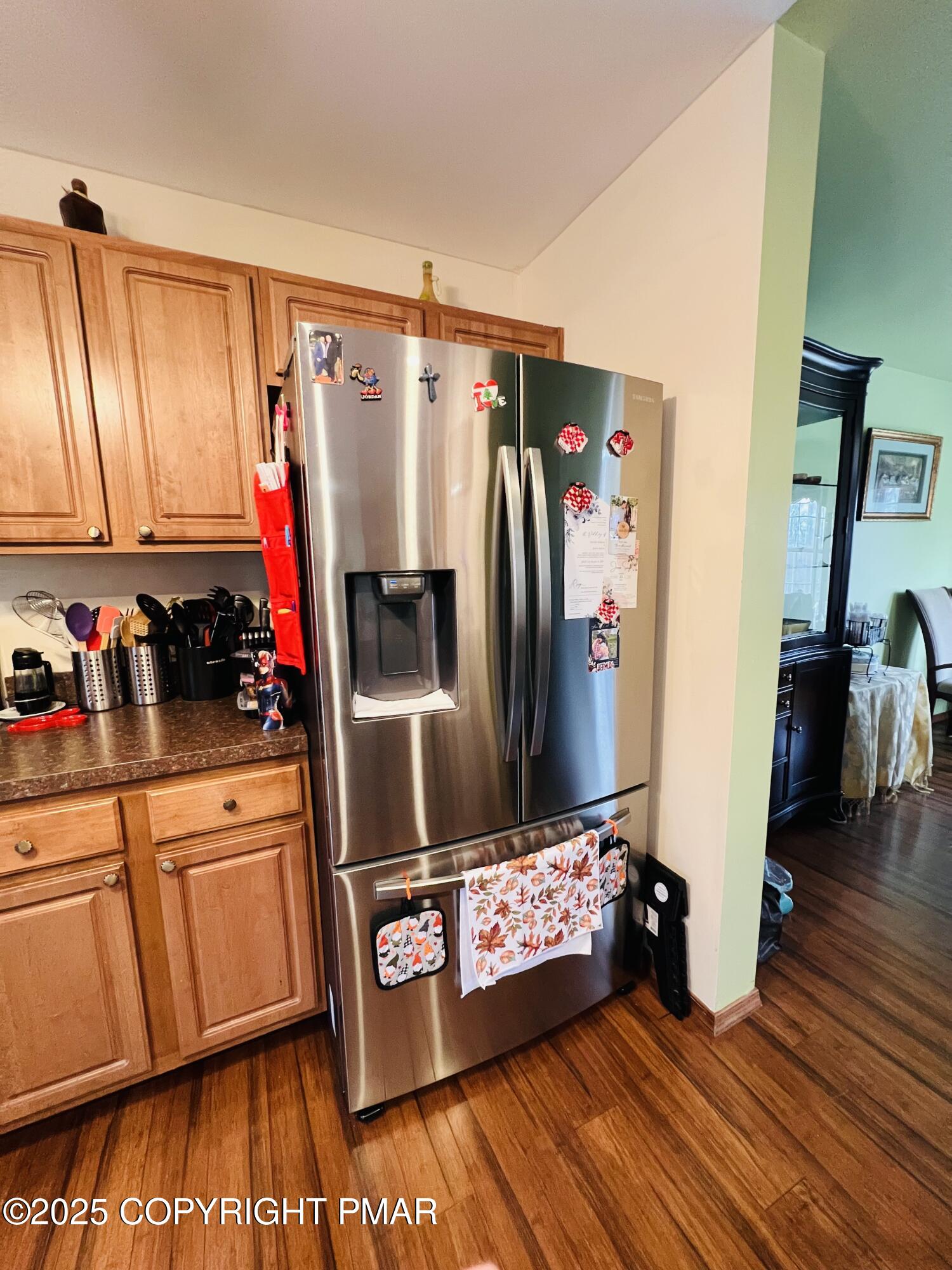 4373 Pine Ridge Drive East Bushkill, PA 18324 - Photo 2 of 39 a kitchen with stainless steel appliances a refrigerator and a wooden floor