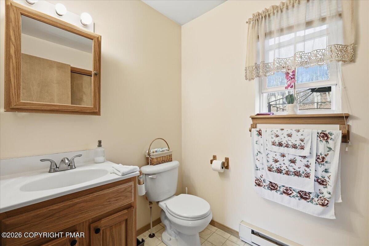 4373 Pine Ridge Drive East Bushkill, PA 18324 - Photo 21 of 33 a bathroom with a granite countertop sink and a mirror