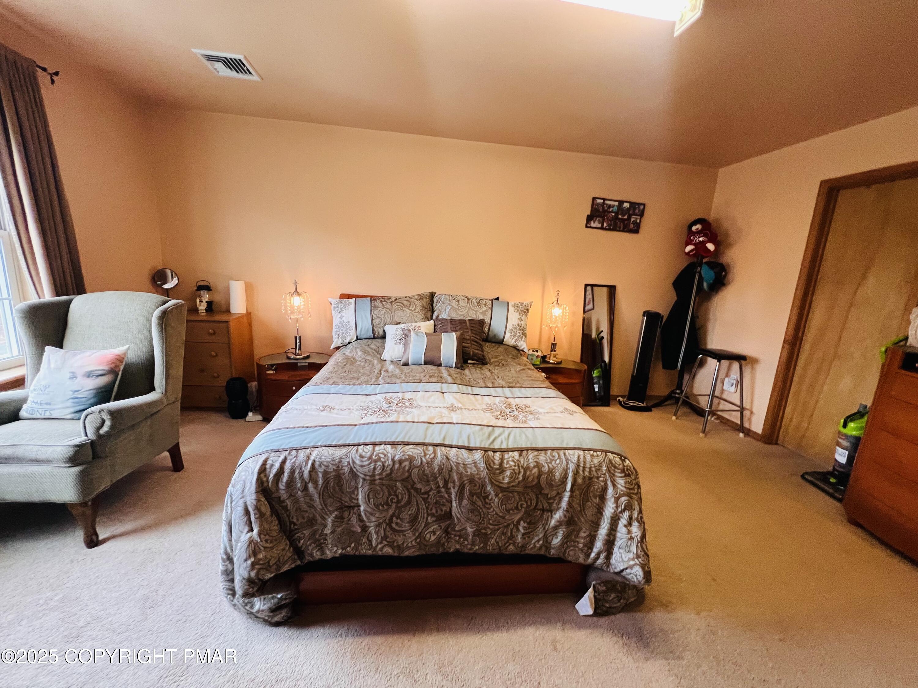 4373 Pine Ridge Drive East Bushkill, PA 18324 - Photo 24 of 39 a bedroom with a bed and a mirror