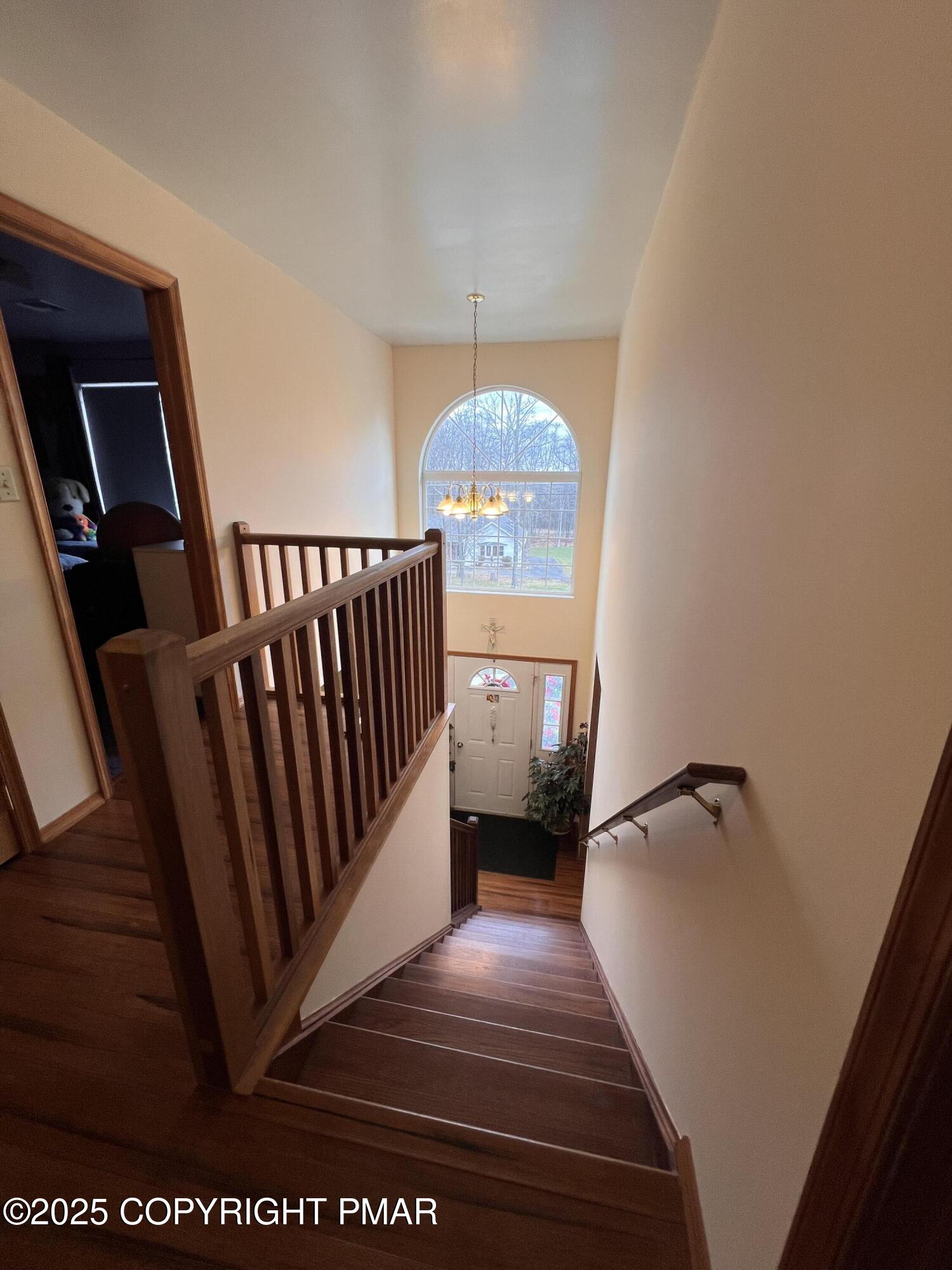4373 Pine Ridge Drive East Bushkill, PA 18324 - Photo 25 of 39 a view of hallway with wooden floor and stairs
