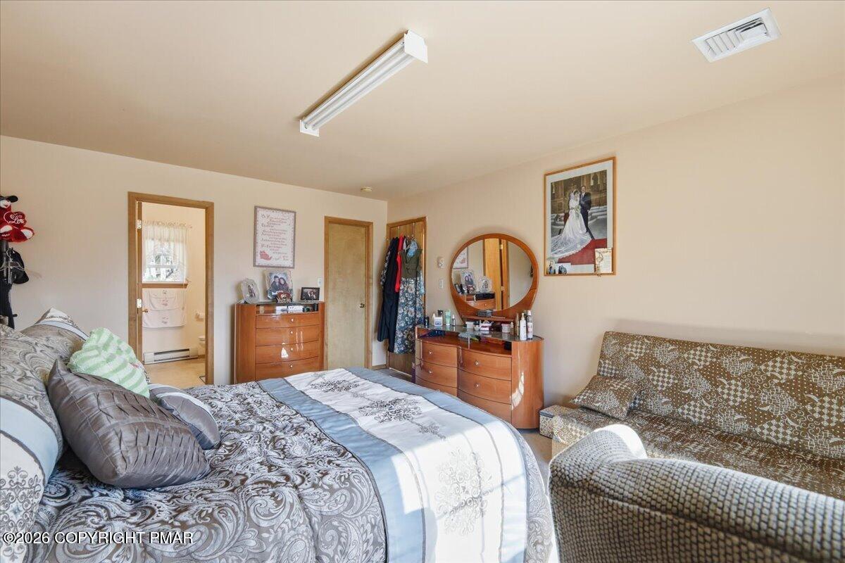 4373 Pine Ridge Drive East Bushkill, PA 18324 - Photo 25 of 33 a bedroom with a bed and dresser
