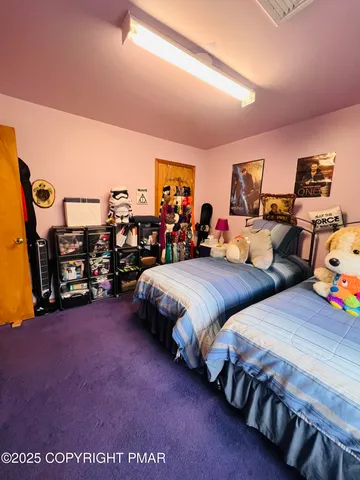 a bed room with bed and a tv