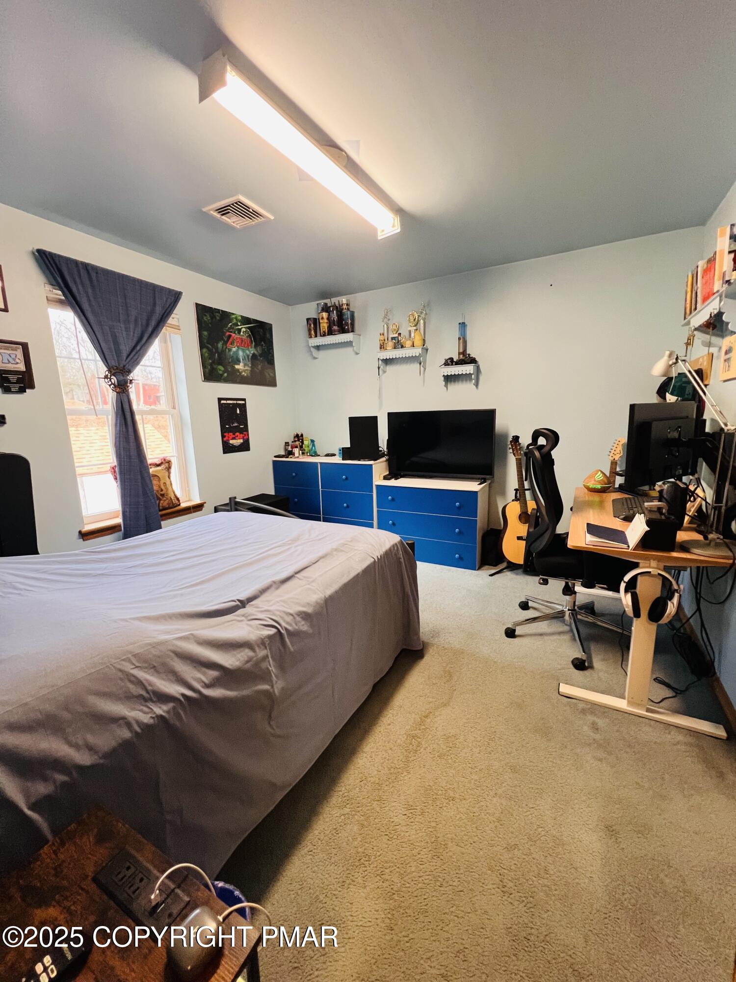 4373 Pine Ridge Drive East Bushkill, PA 18324 - Photo 33 of 39 a bedroom with a bed and dresser