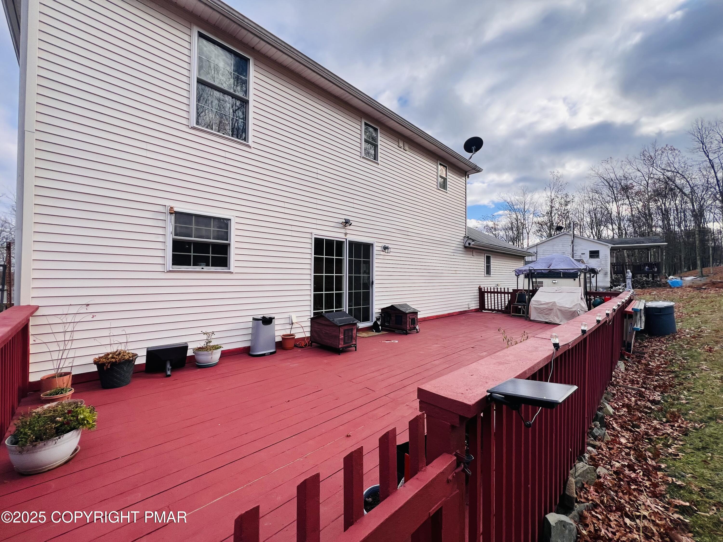 4373 Pine Ridge Drive East Bushkill, PA 18324 - Photo 36 of 39 a view of a patio with table and chairs and potted plants