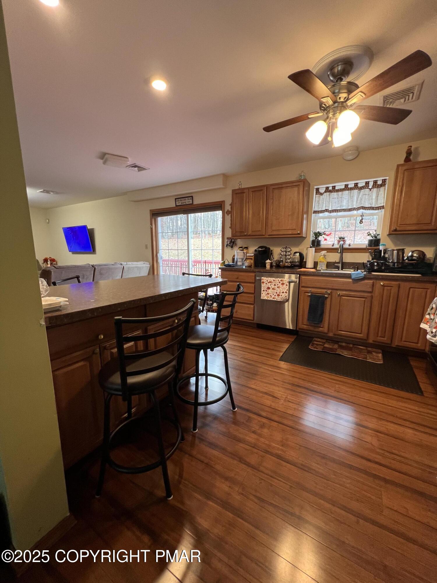 4373 Pine Ridge Drive East Bushkill, PA 18324 - Photo 4 of 39 a view of a dining room with furniture and wooden floor
