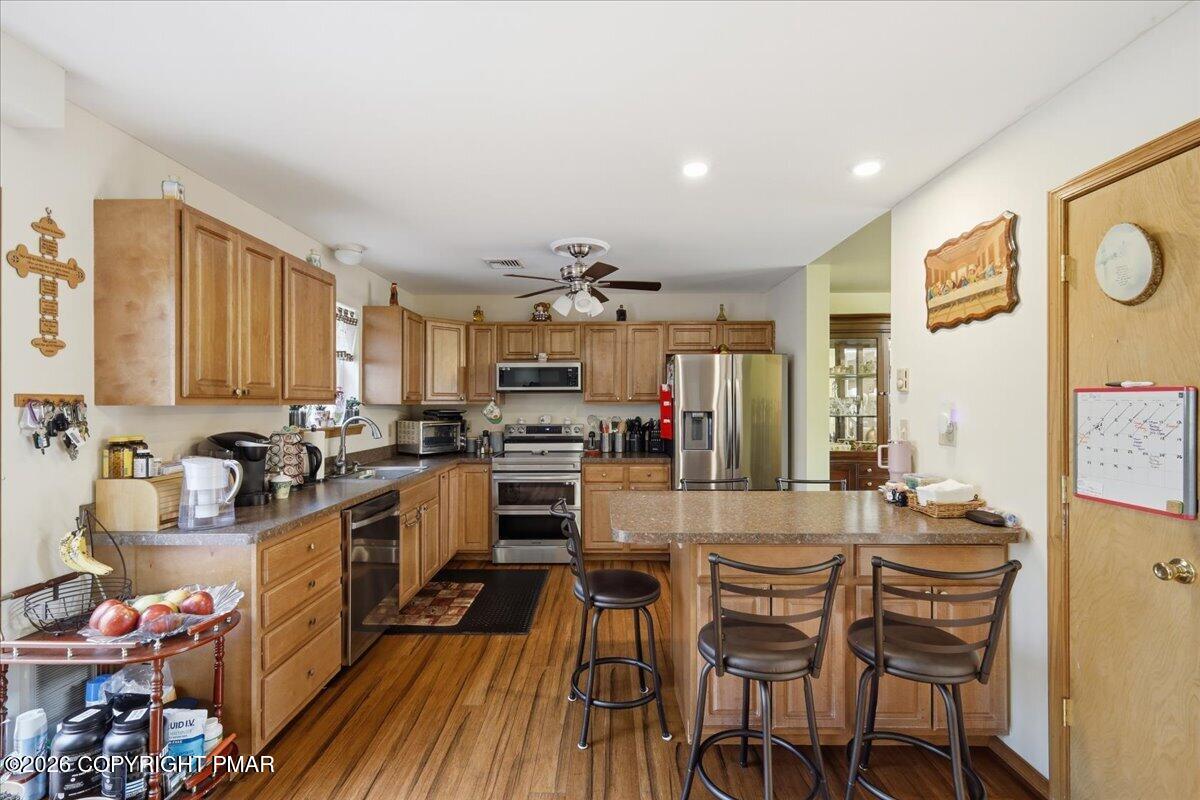 4373 Pine Ridge Drive East Bushkill, PA 18324 - Photo 7 of 33 a kitchen with a sink appliances and cabinets