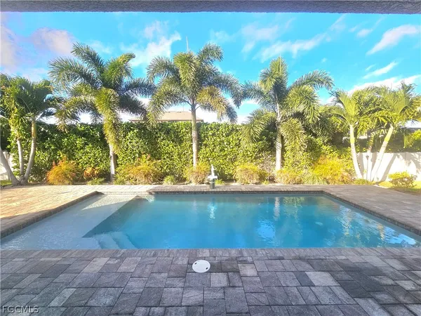 a view of swimming pool from a yard