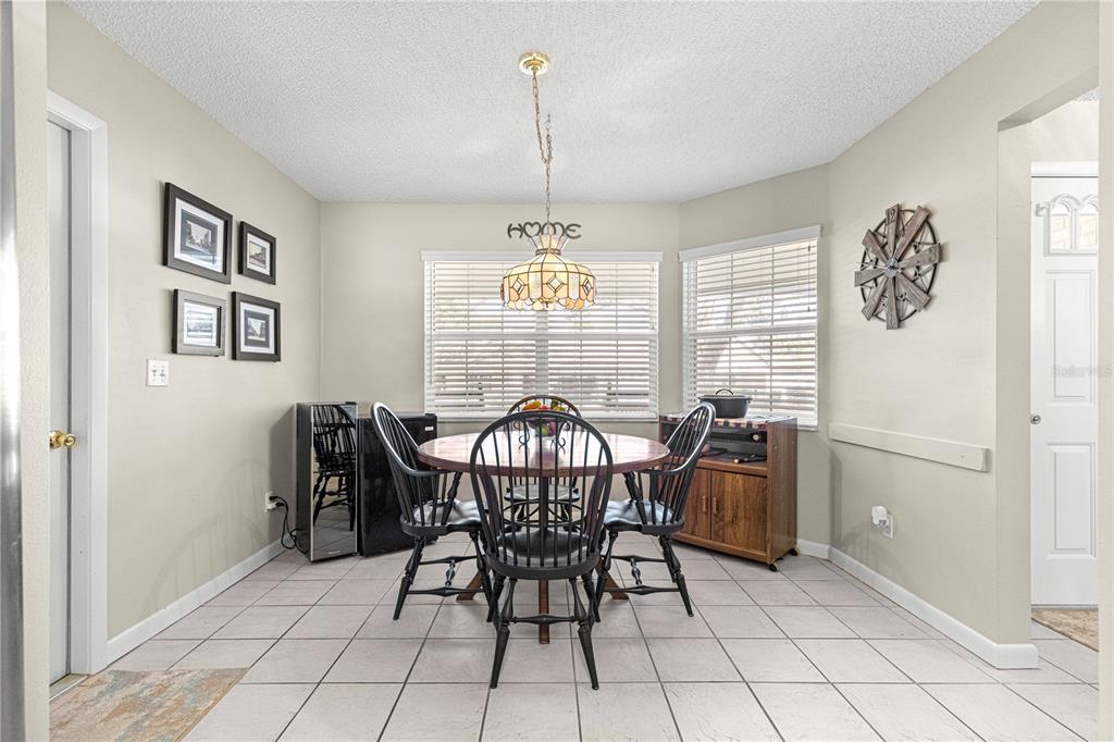 9746 Southwest 96th Street Ocala, FL 34481 - Photo 19 of 57 a view of a dining room with furniture