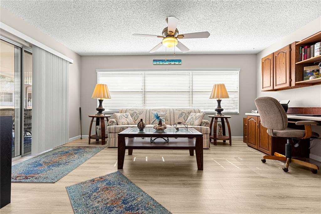 9746 Southwest 96th Street Ocala, FL 34481 - Photo 20 of 57 a living room with furniture and a window