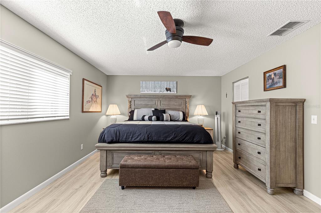 9746 Southwest 96th Street Ocala, FL 34481 - Photo 25 of 57 a bedroom with a bed and window