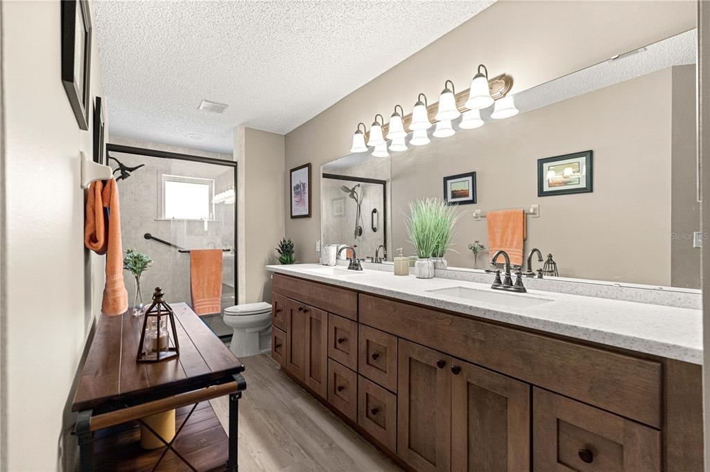 9746 Southwest 96th Street Ocala, FL 34481 - Photo 28 of 57 a bathroom with a double vanity sink and a mirror