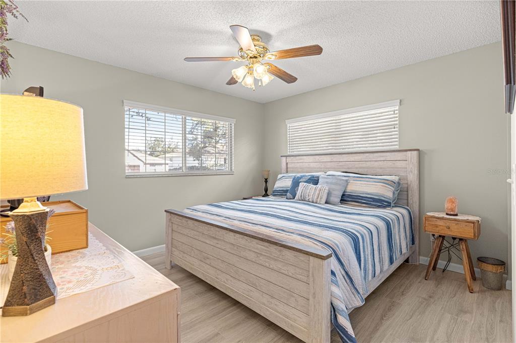 9746 Southwest 96th Street Ocala, FL 34481 - Photo 32 of 57 a bedroom with bed and window