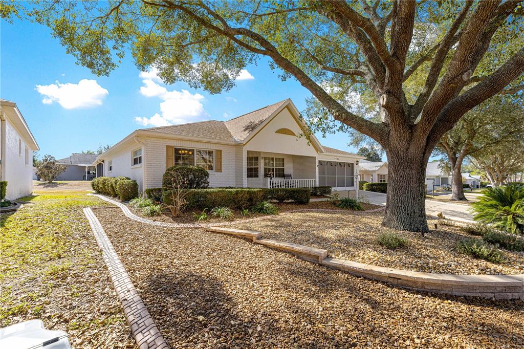 9746 Southwest 96th Street Ocala, FL 34481 - Photo 43 of 57 a front view of a house with a yard