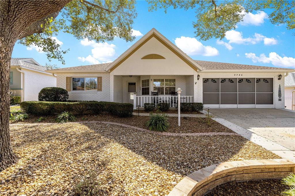 9746 Southwest 96th Street Ocala, FL 34481 - Photo 44 of 57 a front view of a house with garden