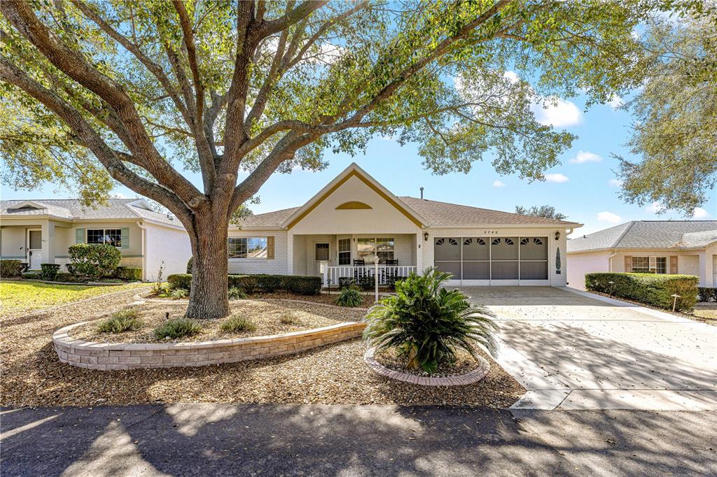 9746 Southwest 96th Street Ocala, FL 34481 - Photo 45 of 57 a front view of a house with garden