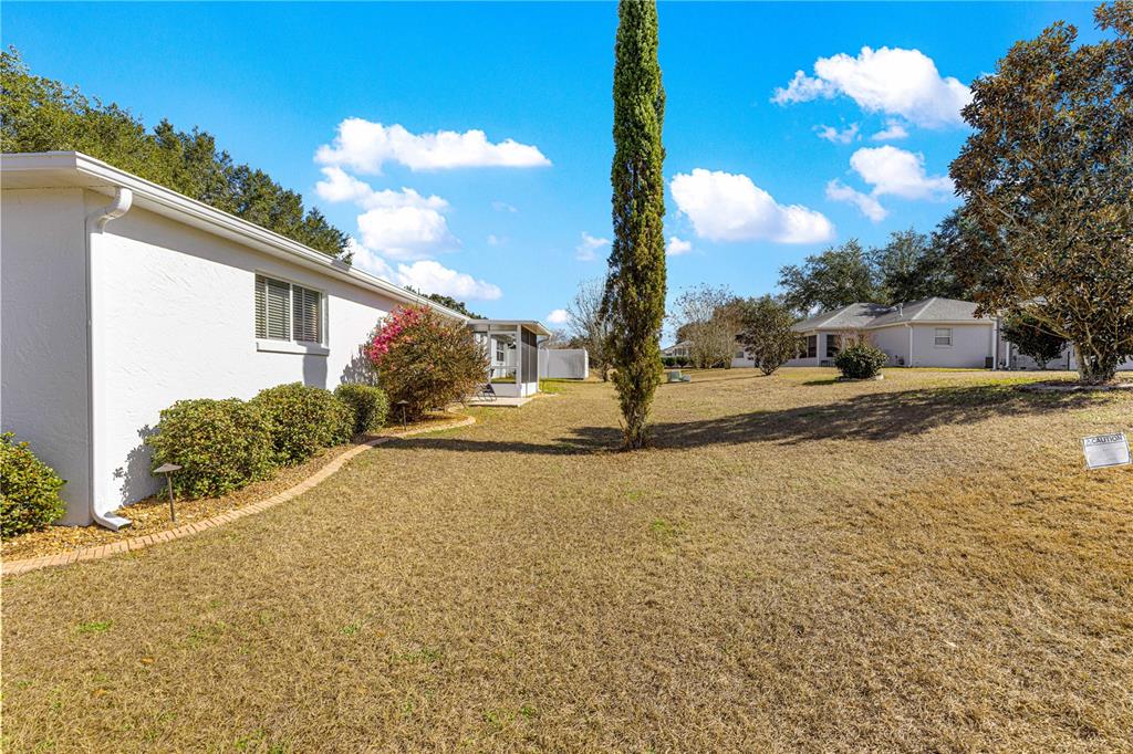9746 Southwest 96th Street Ocala, FL 34481 - Photo 48 of 57 a view of a house with a yard