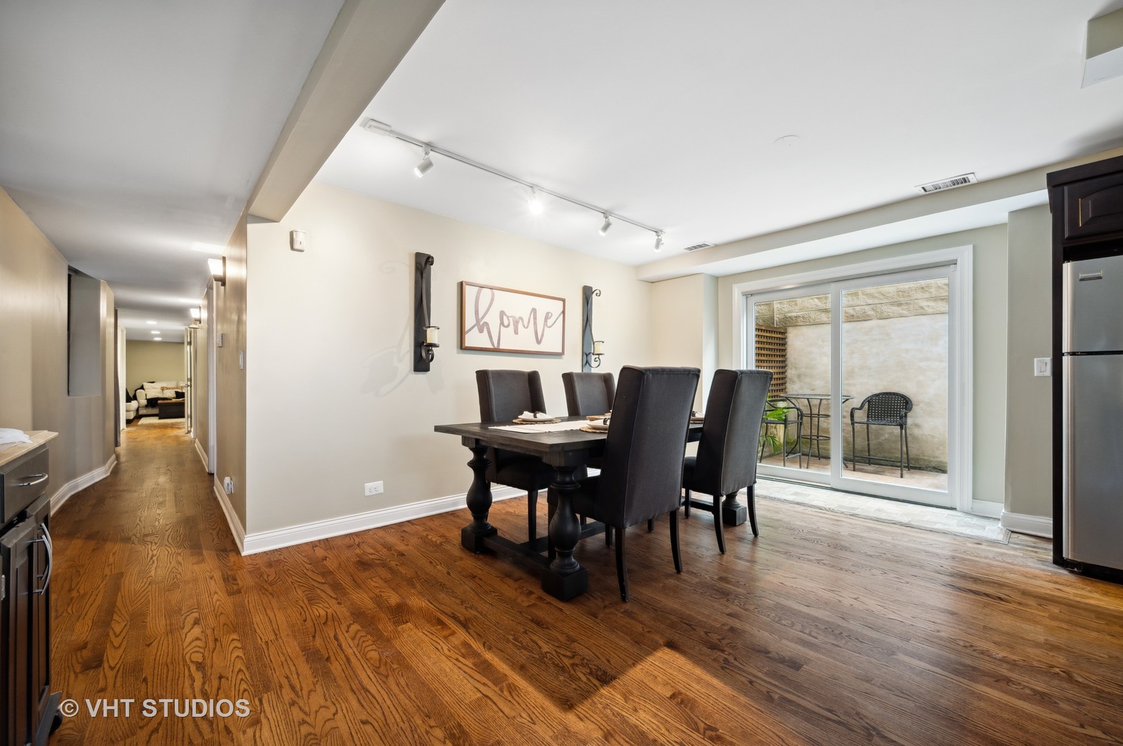 2543 North Racine Avenue, Unit G Chicago, IL 60614 - Photo 5 of 15 a view of a dining room with furniture and wooden floor
