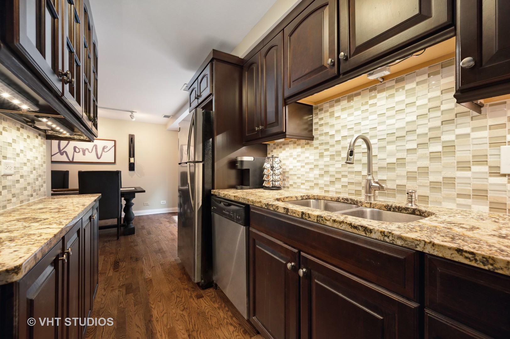 2543 North Racine Avenue, Unit G Chicago, IL 60614 - Photo 6 of 15 a kitchen with stainless steel appliances granite countertop a sink stove and refrigerator