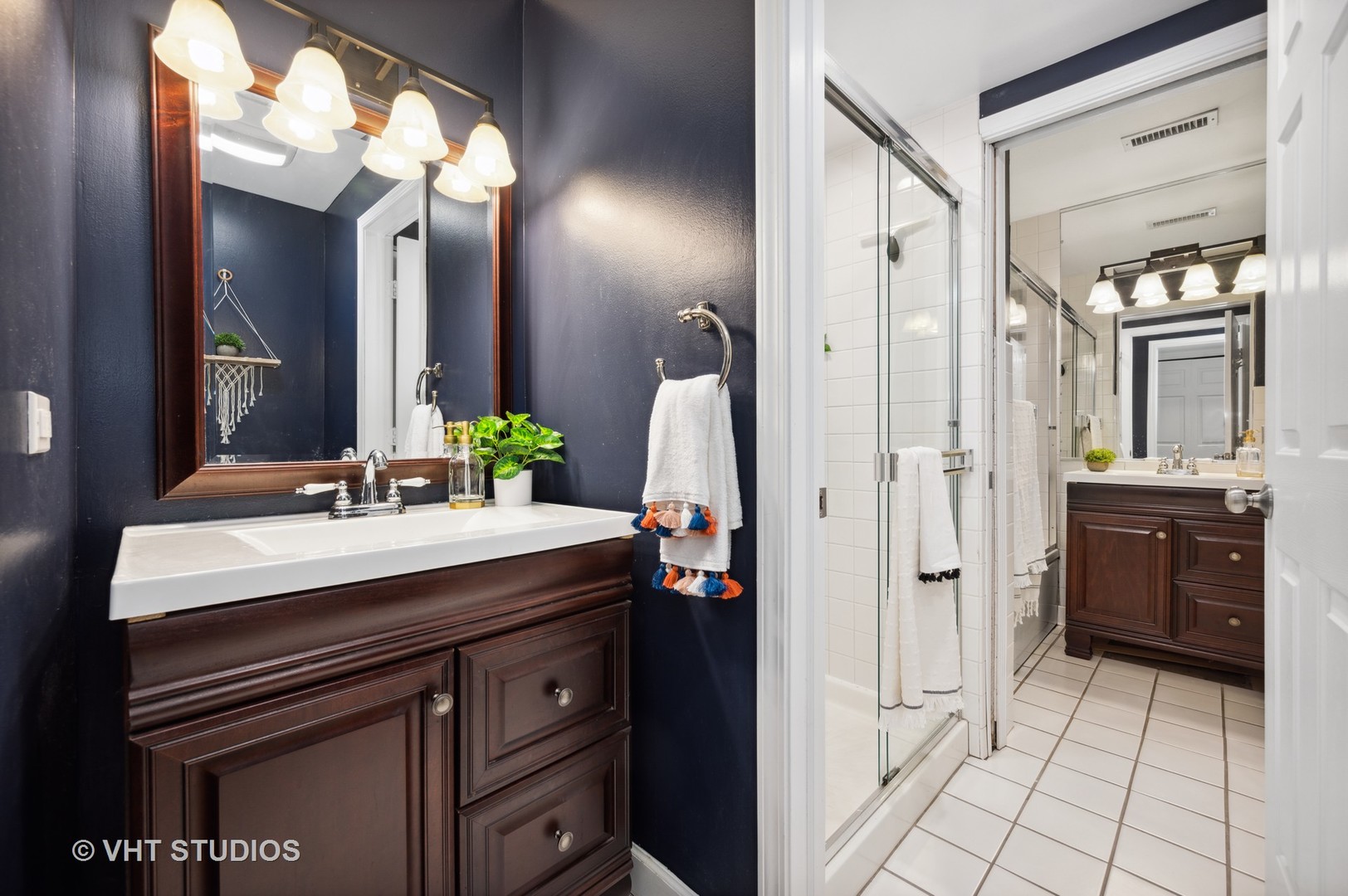 2543 North Racine Avenue, Unit G Chicago, IL 60614 - Photo 9 of 15 a bathroom with a sink a vanity and a mirror