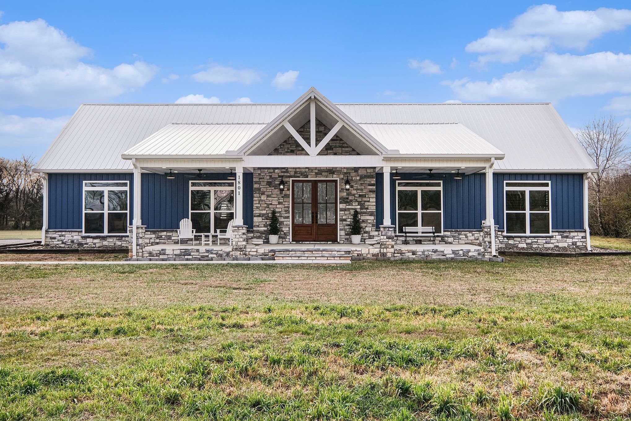 a view of a house with swimming pool and porch with furniture