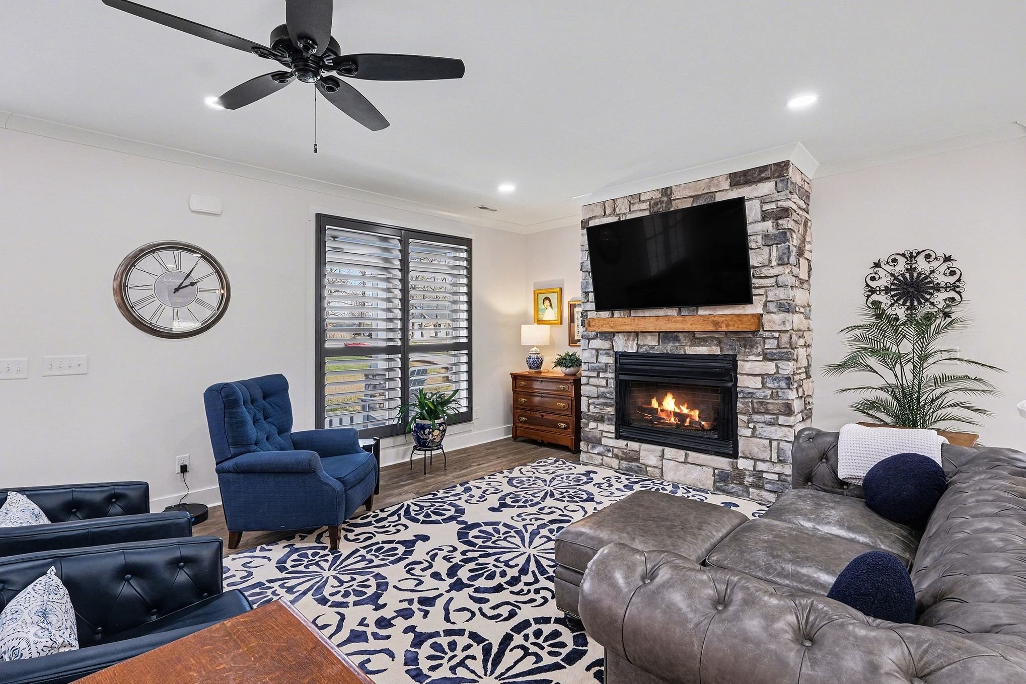 1801 Twin Caves Road Lewisburg, TN 37091 - Photo 11 of 43 a living room with furniture a flat screen tv and a fireplace