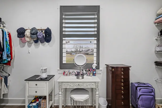 a bedroom with a bed and cabinets