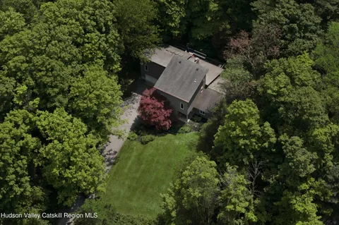 an aerial view of a house with a garden