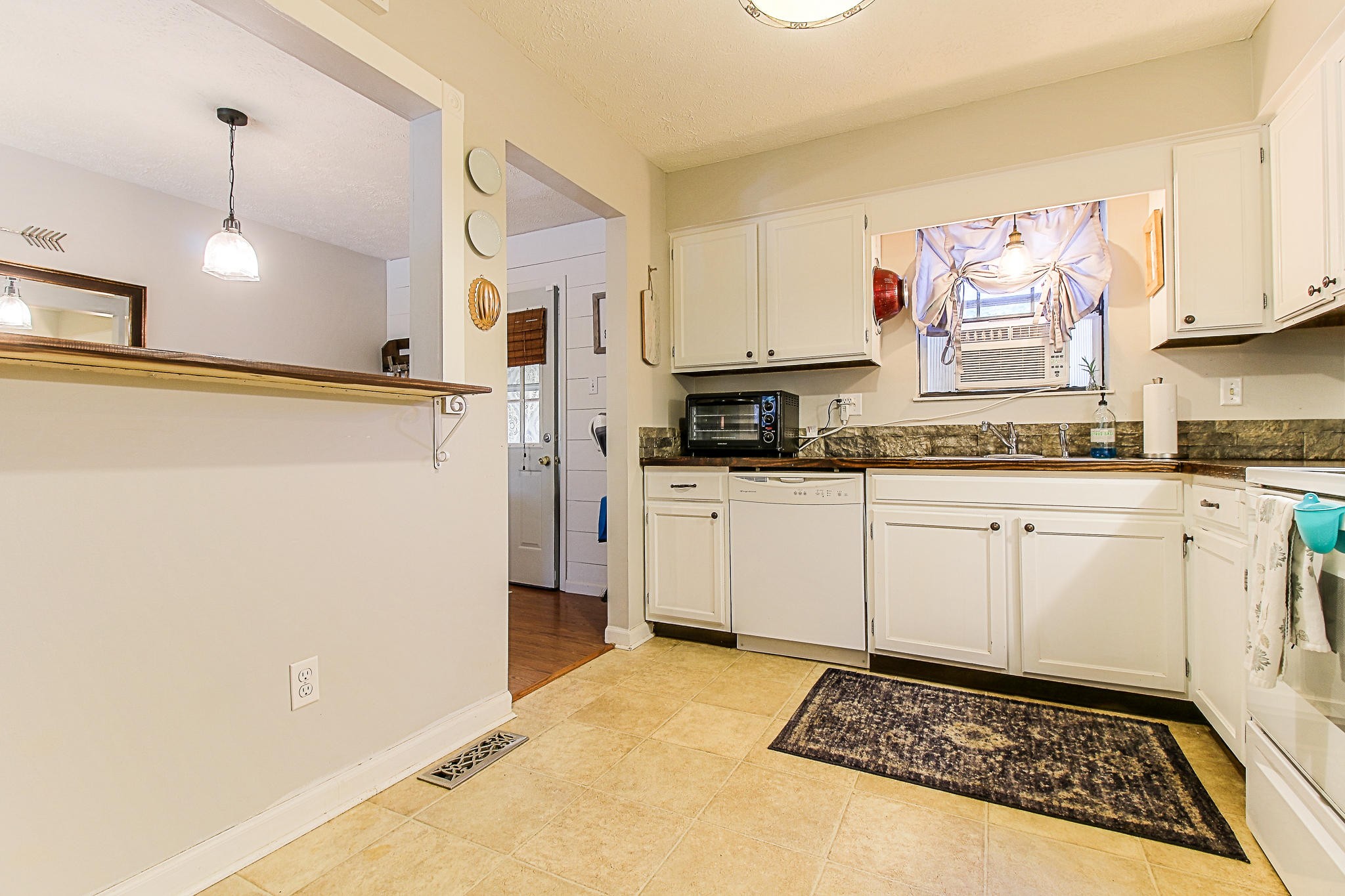 4129 Angola Road Knoxville, TN 37921 - Photo 11 of 28 a kitchen with a sink a refrigerator and cabinets
