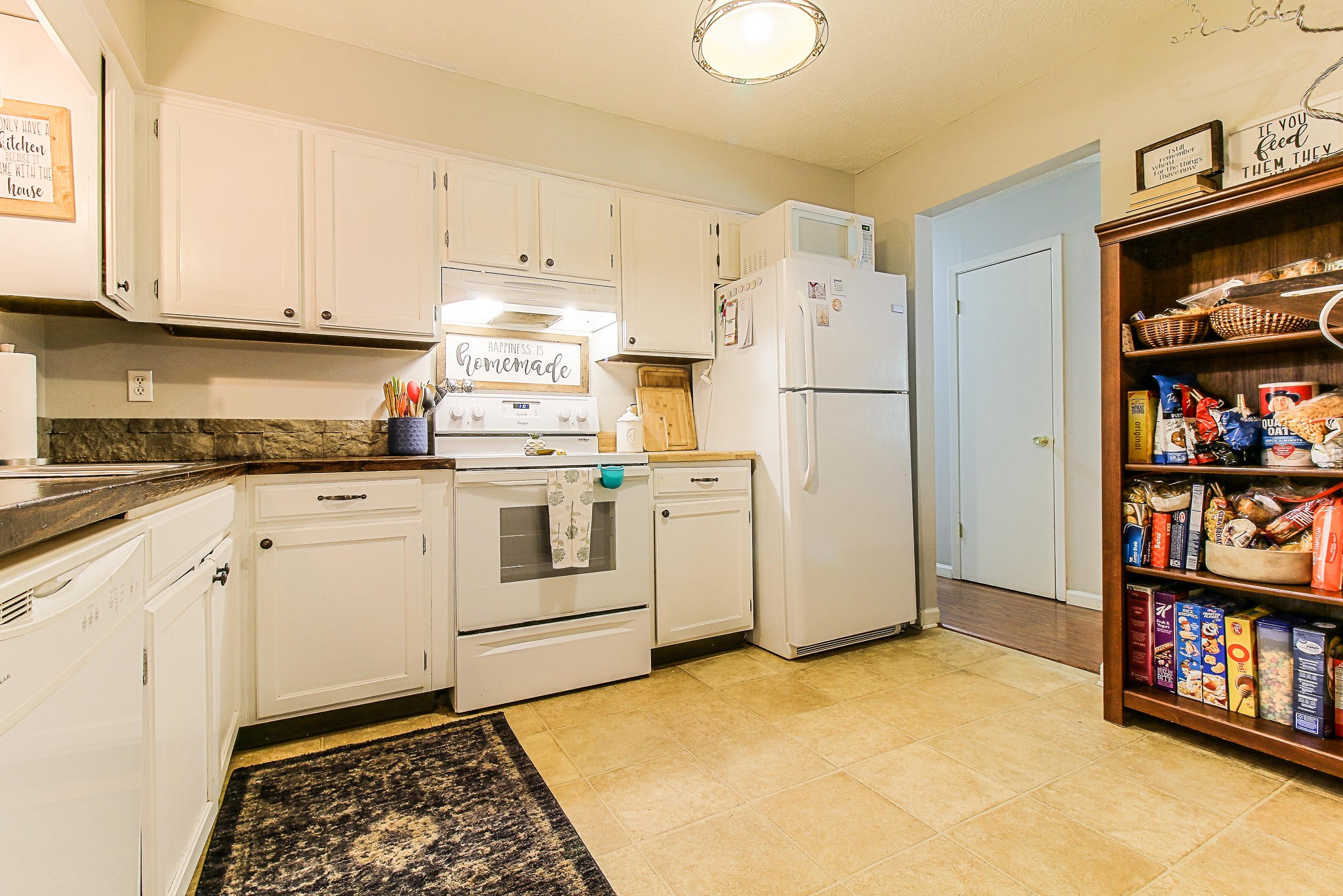 4129 Angola Road Knoxville, TN 37921 - Photo 10 of 28 a kitchen with white cabinets and white appliances