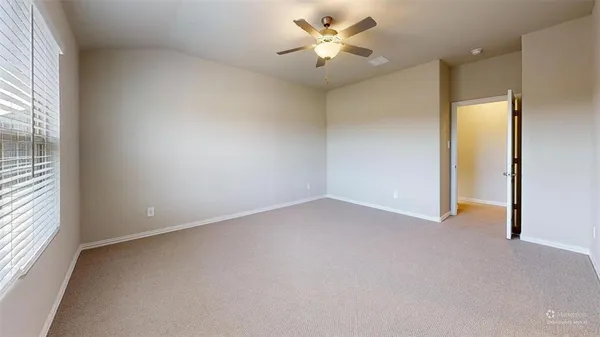 a view of a room with shelf on the wall