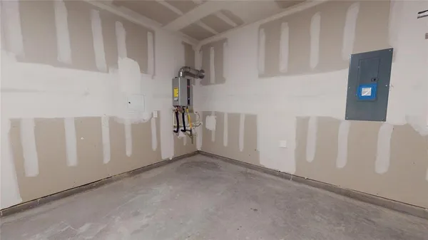 a large kitchen with cabinets and wooden floor