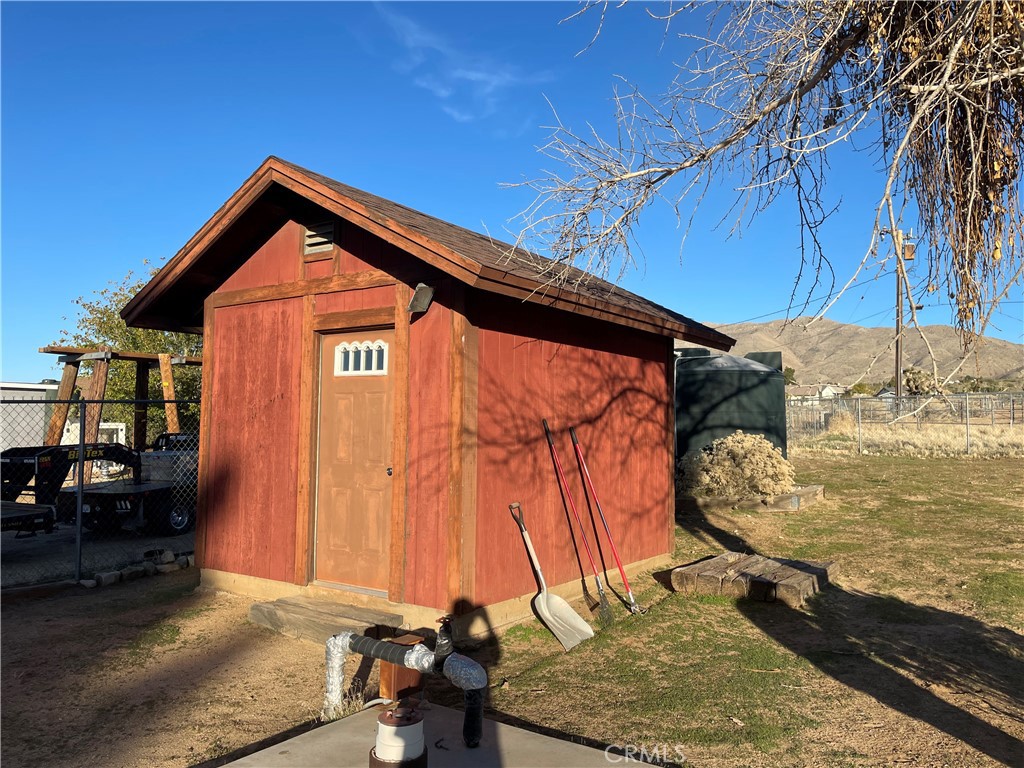 19574 Happy Valley Road Apple Valley, CA 92308 - Photo 29 of 58 a front view of a house with a yard