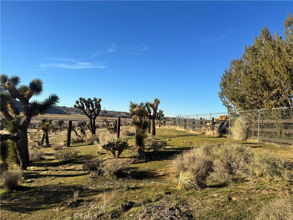 19574 Happy Valley Road Apple Valley, CA 92308 - Photo 4 of 58 In front of Entry Gate