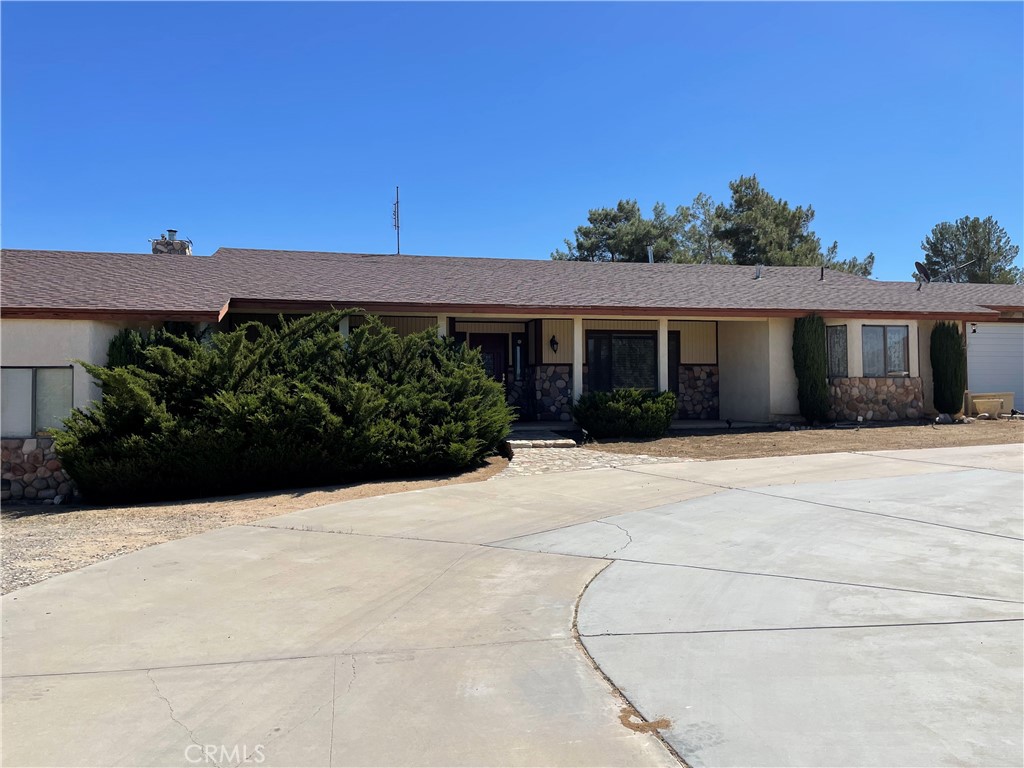 19574 Happy Valley Road Apple Valley, CA 92308 - Photo 45 of 58 a front view of a house with a yard