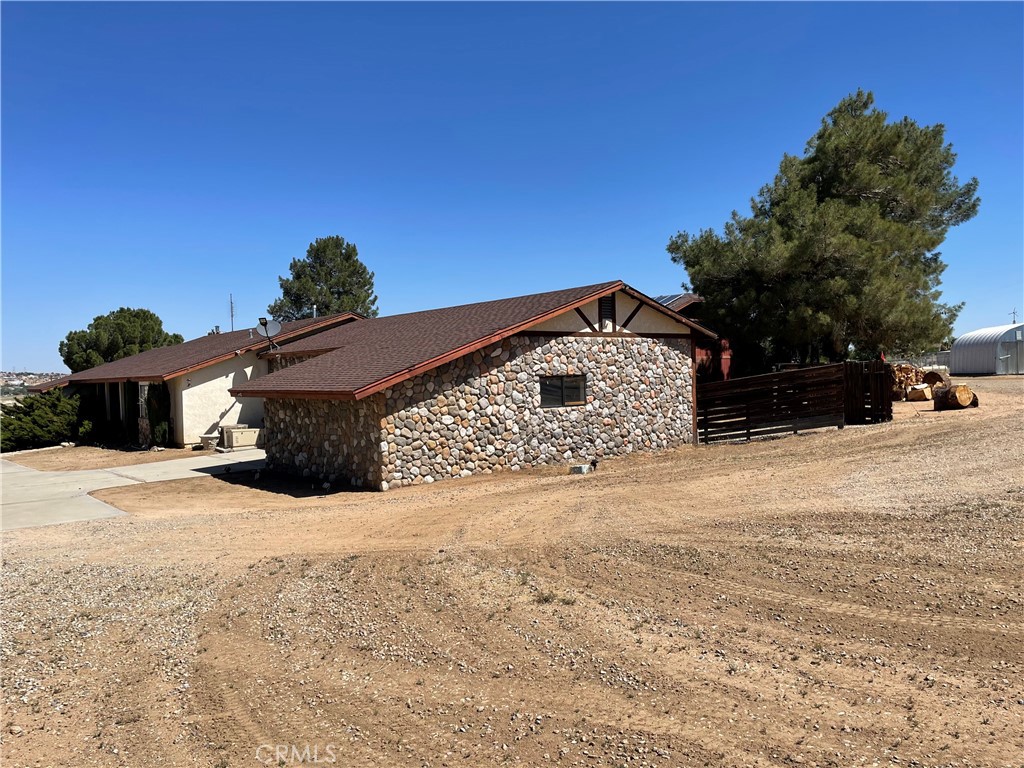 19574 Happy Valley Road Apple Valley, CA 92308 - Photo 49 of 58 a view of a backyard of a house