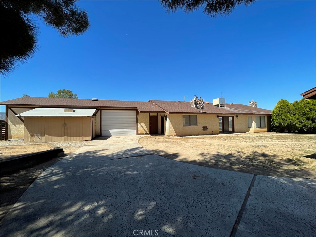 19574 Happy Valley Road Apple Valley, CA 92308 - Photo 55 of 58 a front view of a house with a yard