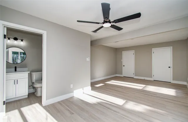 a view of an entryway and wooden floor