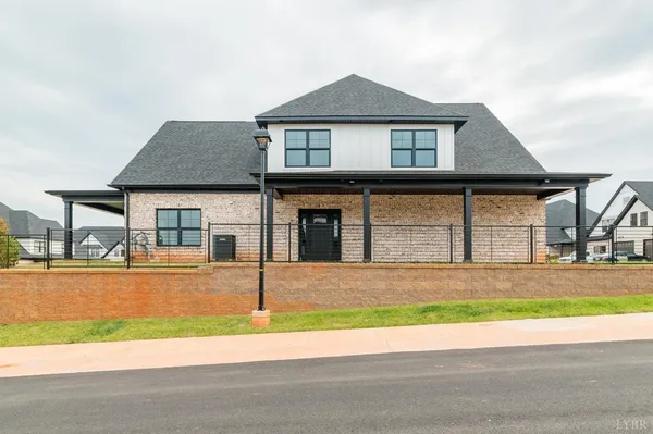 a kitchen with white cabinets and appliances