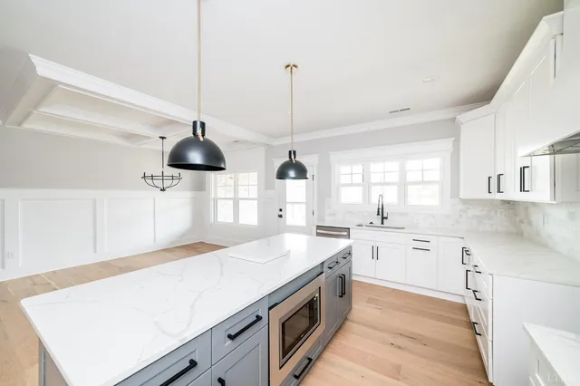 a kitchen that has a lot of cabinets in it
