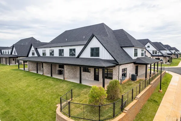 a bathroom with a granite countertop sink a shower and a mirror
