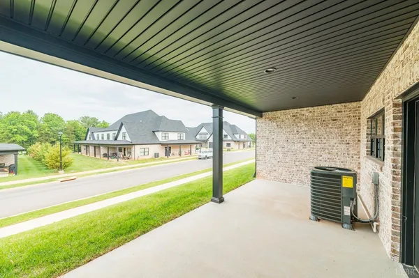 a view of house with yard porch and furniture