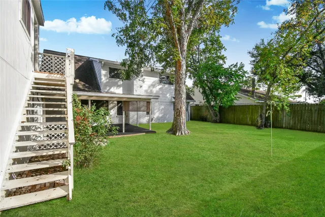 a view of a back yard of the house