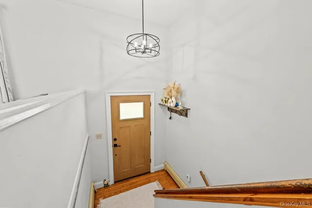 a view of room with window and wooden floor