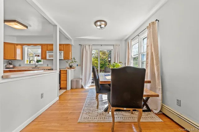a view of a dining room with furniture window and outside view